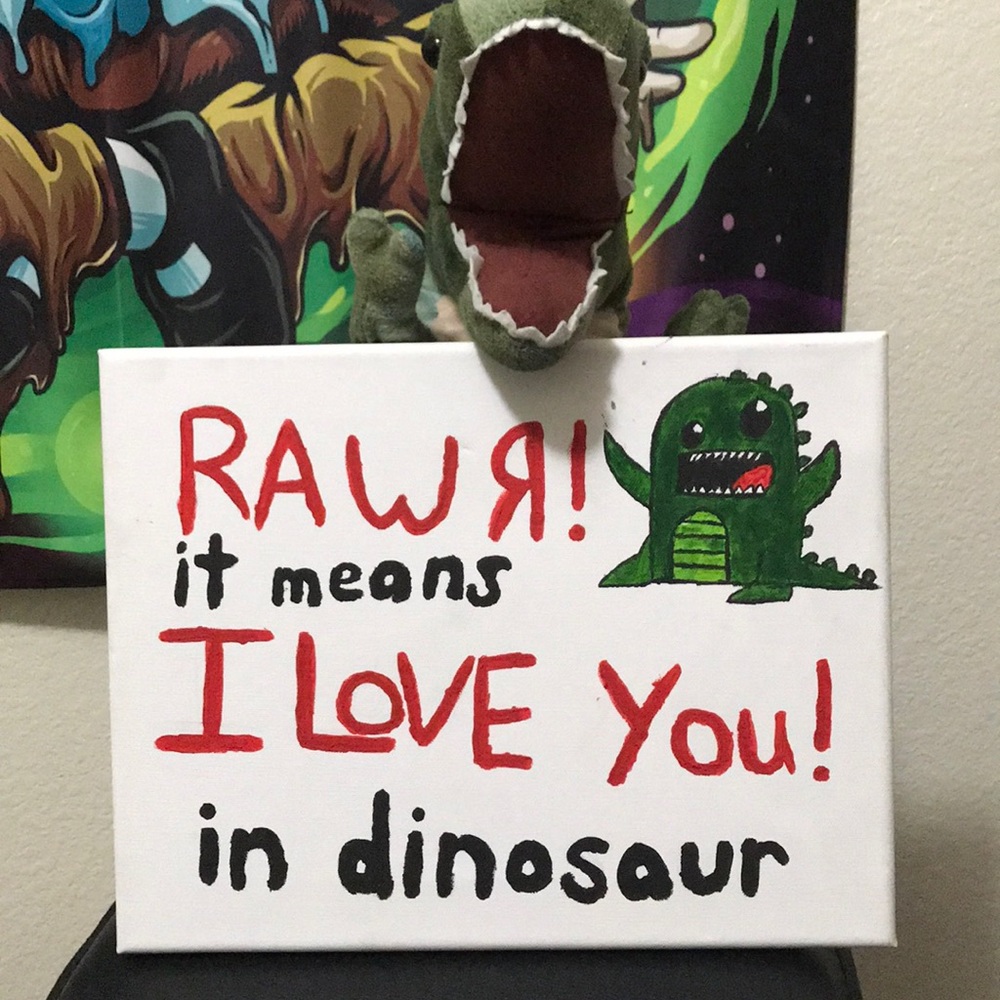 T-Rex stuffed animal with canvas painting